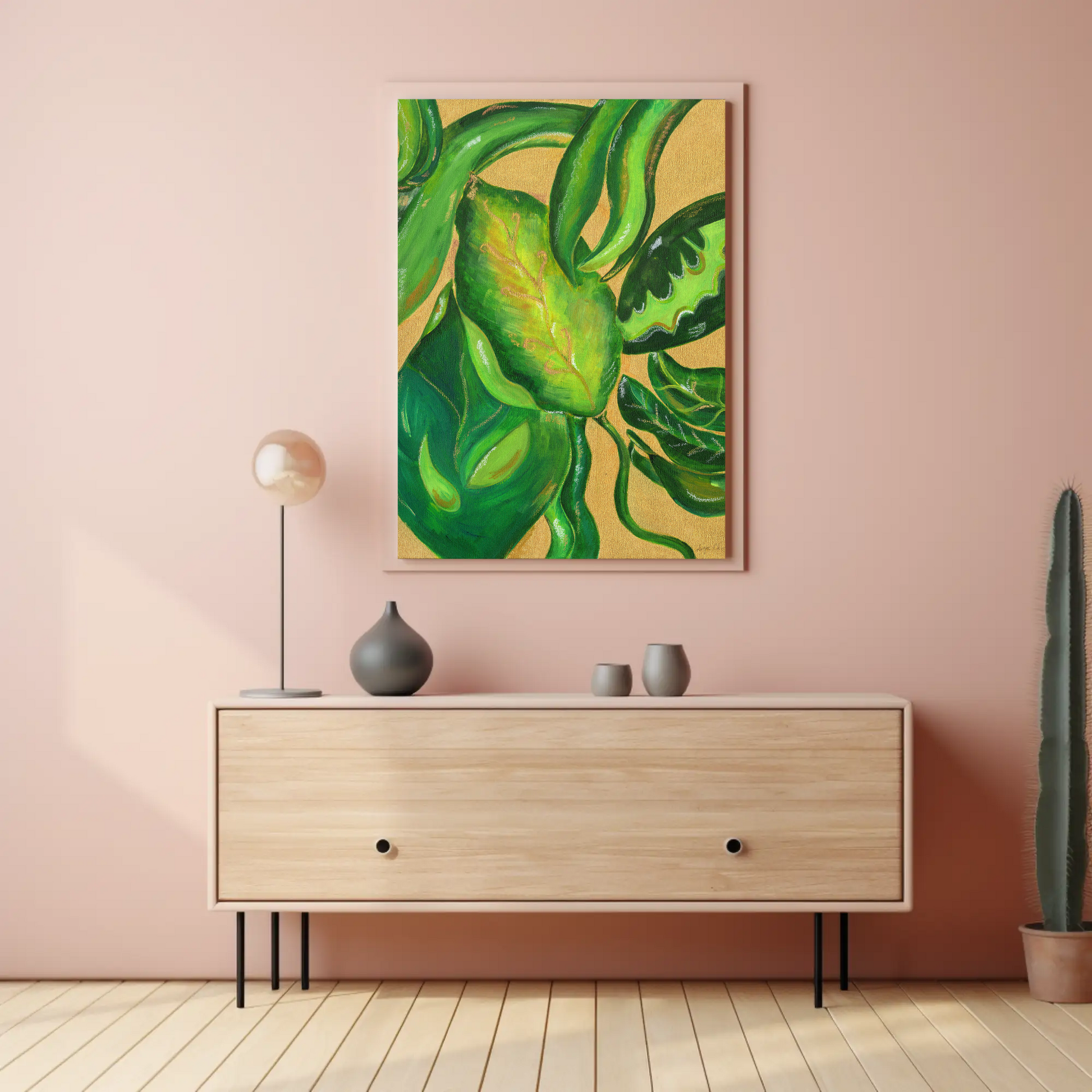Modern interior with a wooden cabinet, decorative items, and a green leafy plant on a pink wall.