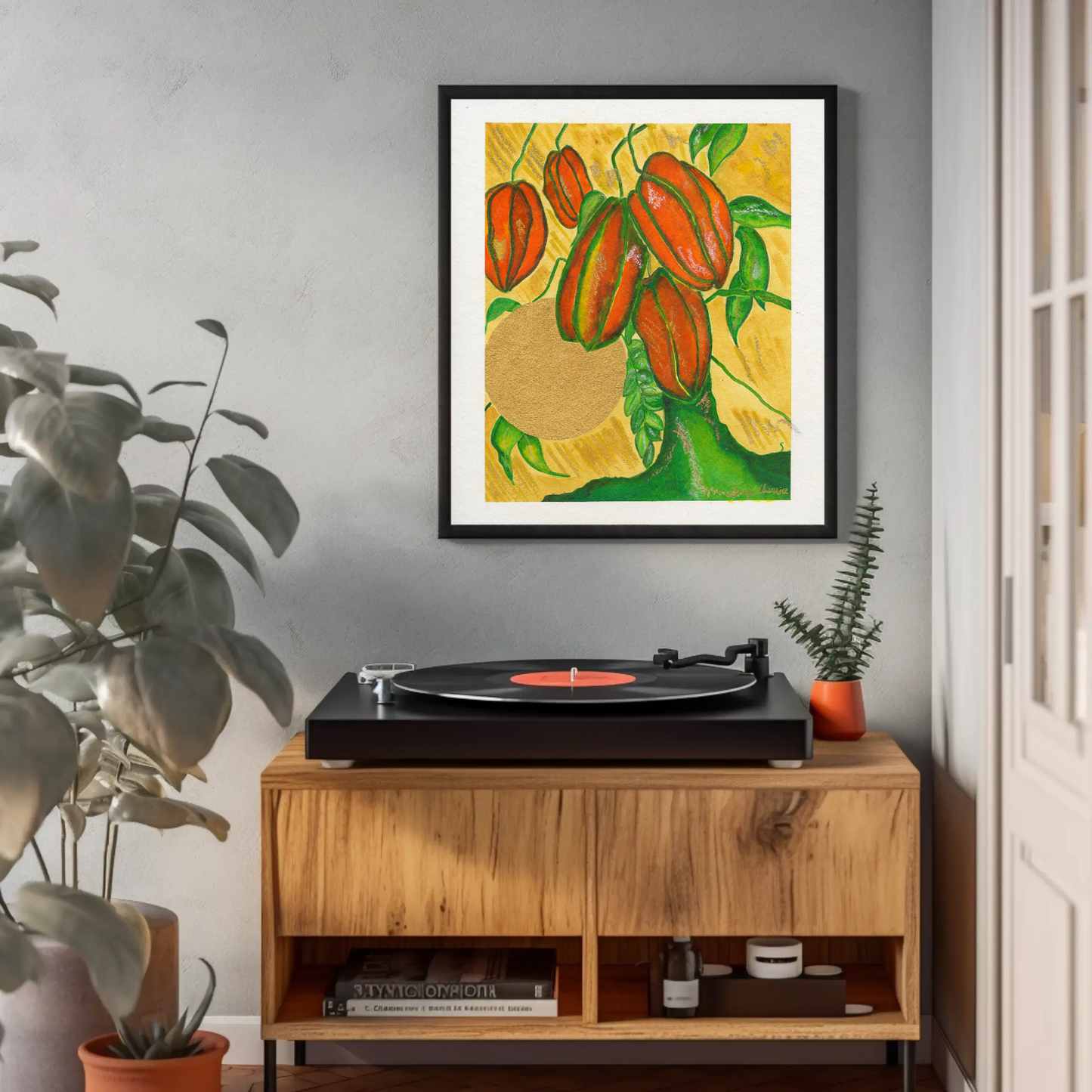 Star Fruit Art Print framed above a record player and wooden cabinet by Anya Cherrice