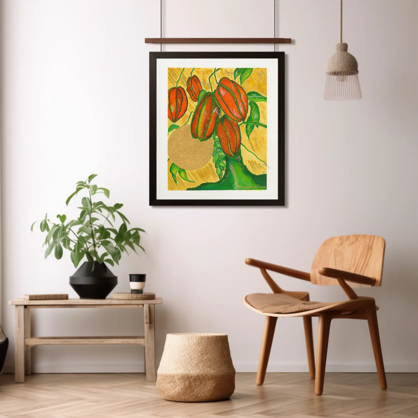 Star Fruit Art Print in a black frame above a wooden chair and side table by Anya Cherrice